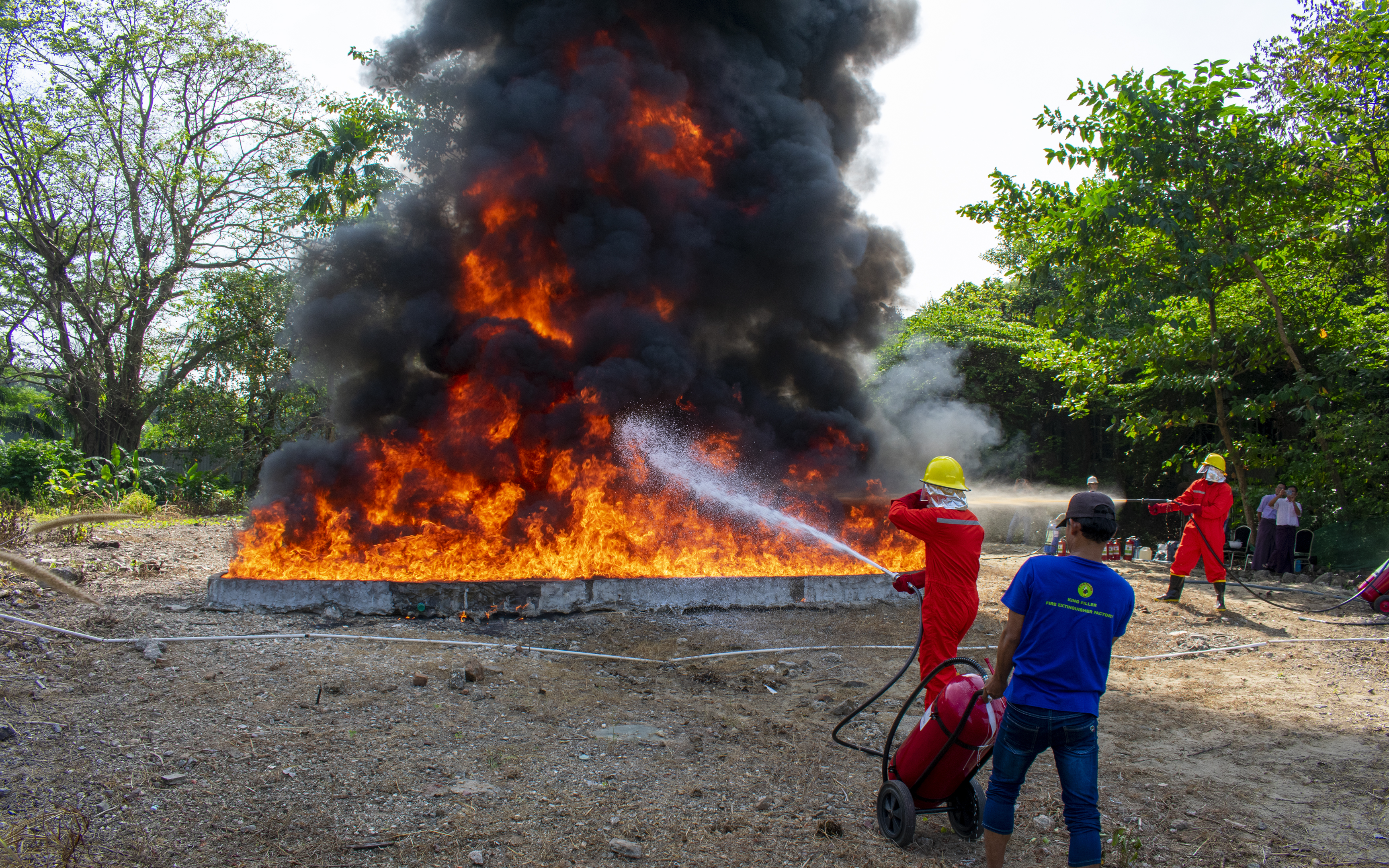 Practical fire extinguisher demonstration for Htoo Group